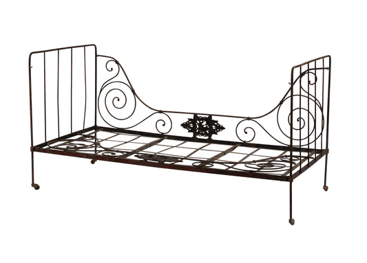 Beautiful and large dark metal daybed on small castors with lovely hand forged iron motifs from an estate near Annecy