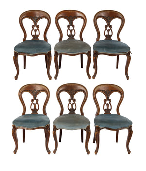 Early 20th Century antique French timber dining chairs with upholstered seats and hand carved backs. Discovered in an old mansion in Megève